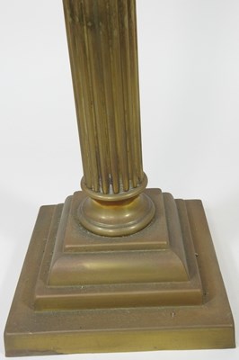 Lot 124 - A brass column oil lamp