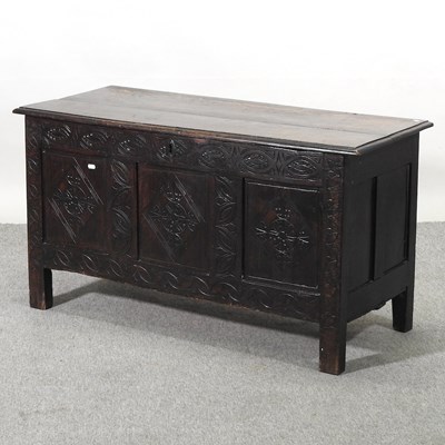 Lot 448 - A carved oak coffer