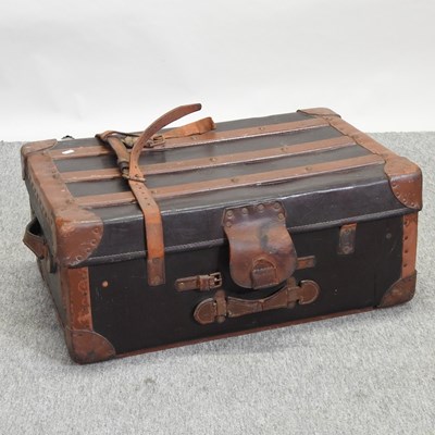 Lot 383 - A vintage leather bound trunk