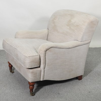 Lot 555 - An upholstered armchair
