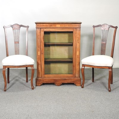Lot 566 - A pier cabinet and two chairs