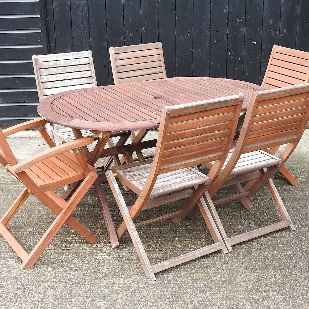 Lot 354 A garden table and chairs