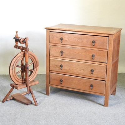 Lot 534 - An oak chest and spinning wheel