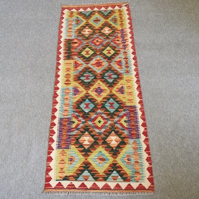 Lot 423 - A kelim runner