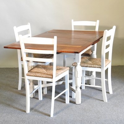 Lot 425 - A dining table and chairs