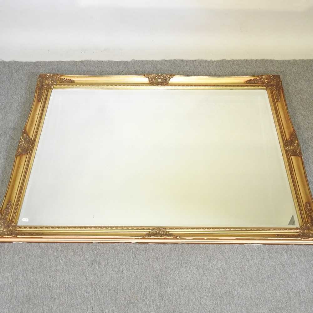 Lot 162 A large gilt framed wall mirror