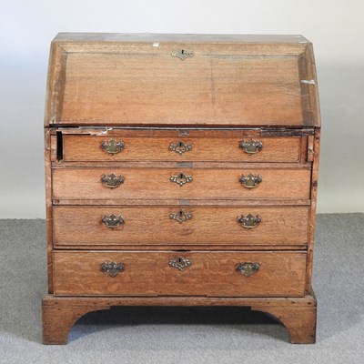 Lot 616 - A George III oak bureau