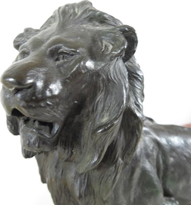 Lot 126 - A bronzed model of a lion