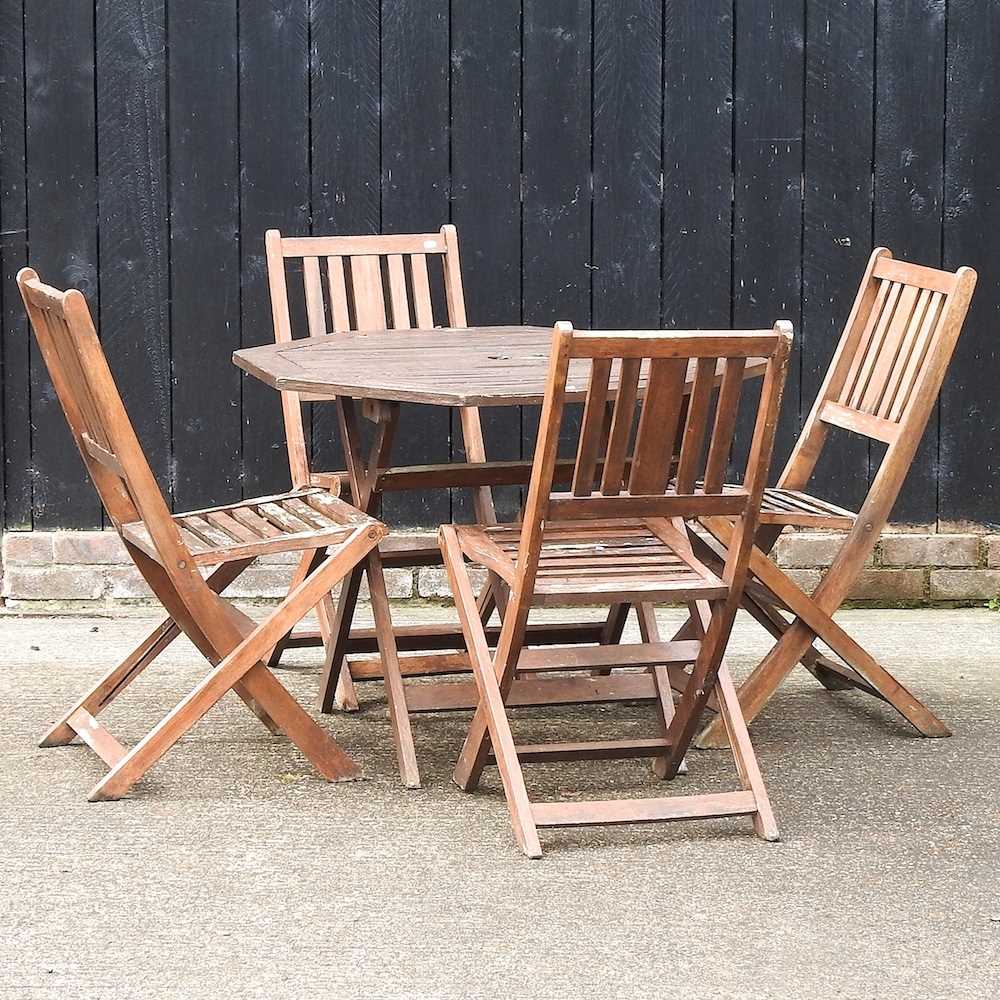 Lot 385 A garden table and chairs