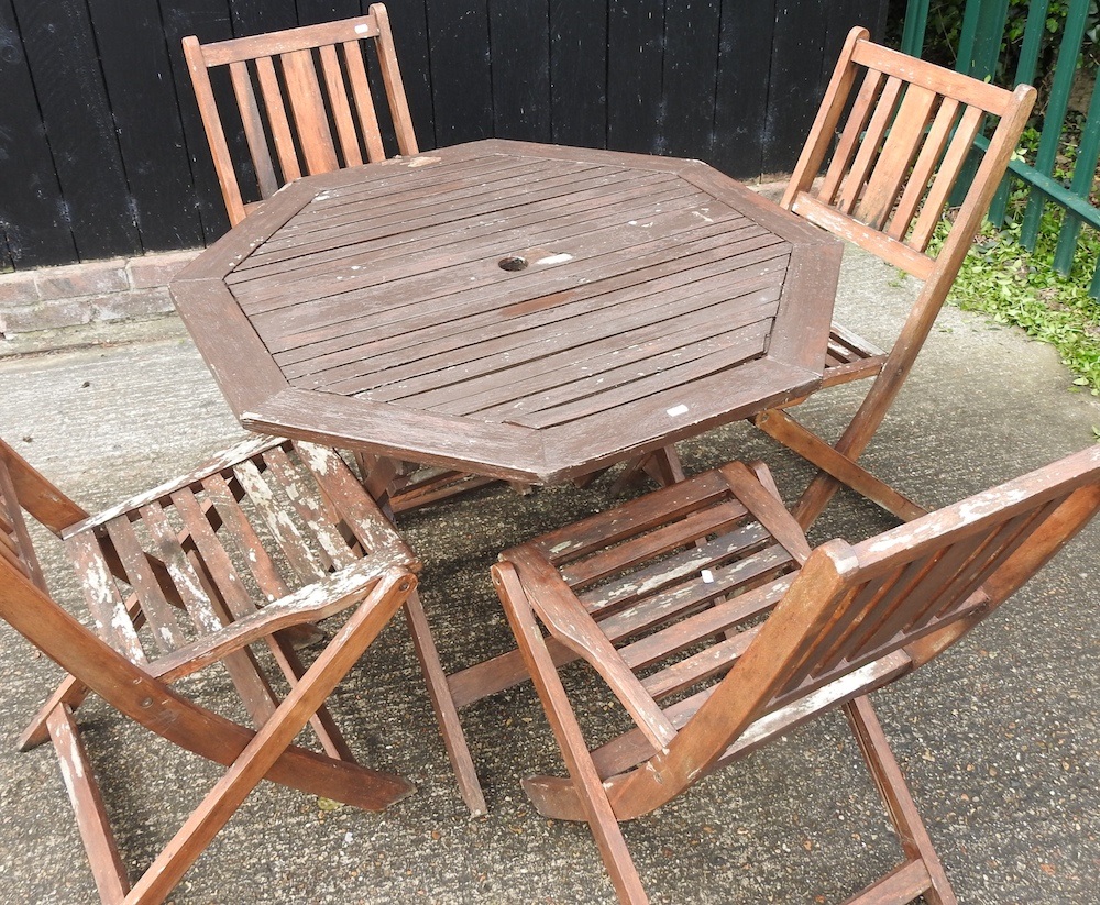 Lot 385 A garden table and chairs
