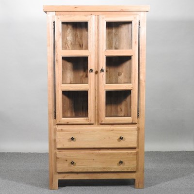 Lot 459 - An oak glazed bookcase