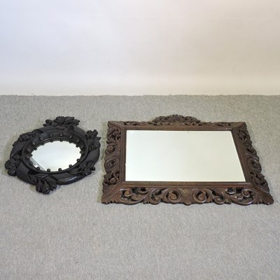 Lot 227 - A carved oak wall mirror