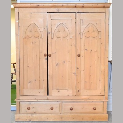 Lot 439 - A pine triple wardrobe