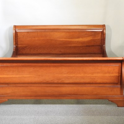 Lot 590 - A cherrywood sleigh bed