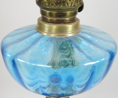Lot 78 - An oil lamp, with a blue glass reservoir