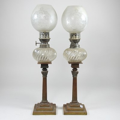 Lot 84 - A pair of peg oil lamps