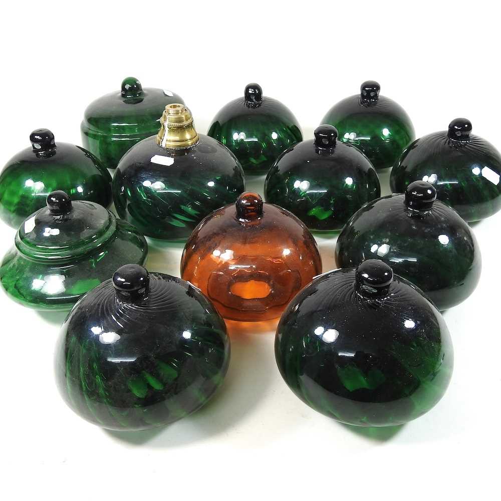 Lot 253 - A collection of green glass oil lamp fonts