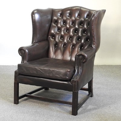 Lot 487 - A wingback armchair