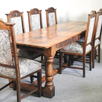 Lot 699 - An elm refectory table and chairs