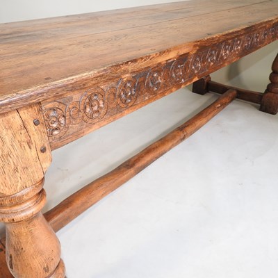 Lot 699 - An elm refectory table and chairs