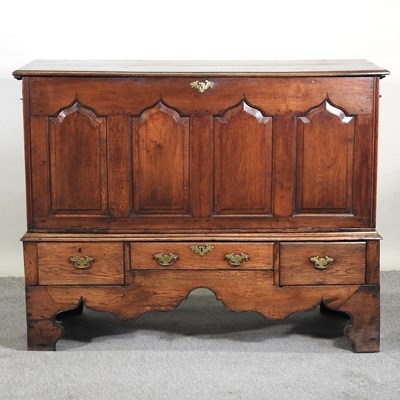 Lot 638 - An 18th century oak coffer on stand