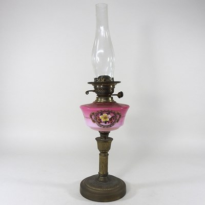 Lot 176 - A brass and pink glass oil lamp base