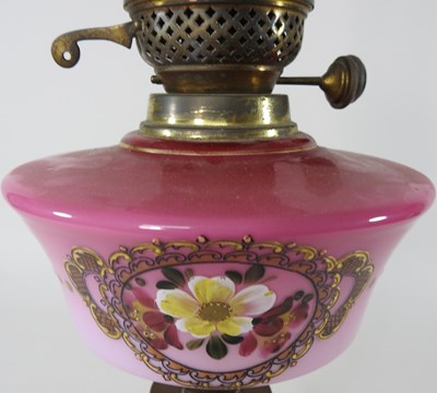 Lot 176 - A brass and pink glass oil lamp base