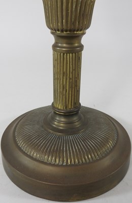 Lot 176 - A brass and pink glass oil lamp base