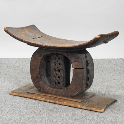 Lot 387 - An Ashanti carved wooden head rest