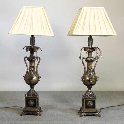 Lot 604 - A pair of gilt metal table lamps