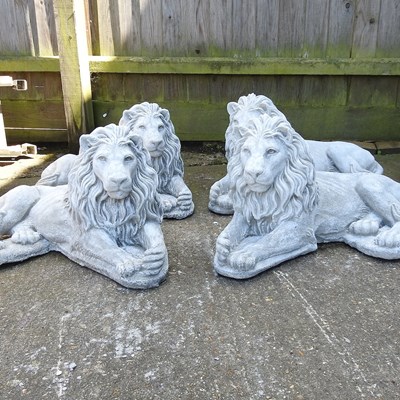 Lot 303 - Two pairs of lion statues