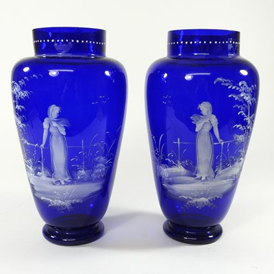 Lot 31 - A pair of Mary Gregory style blue glass vases