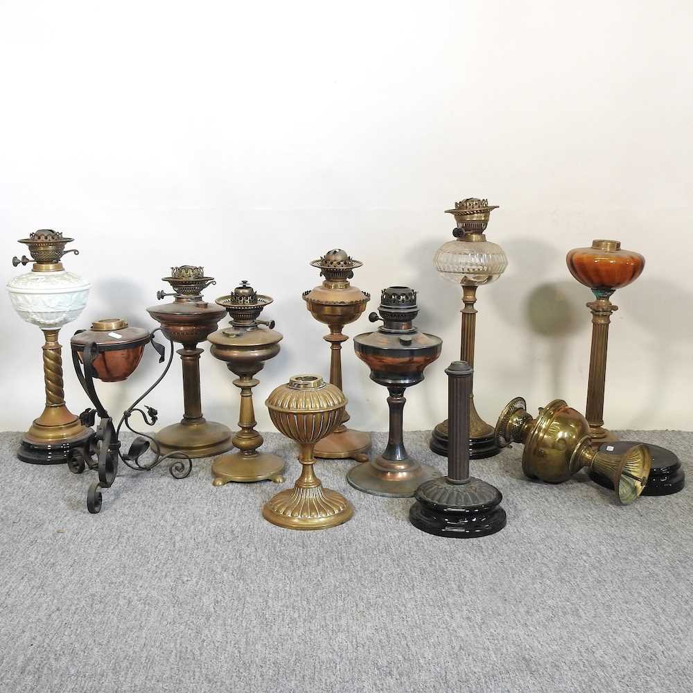 Lot 172 A collection of oil lamp bases
