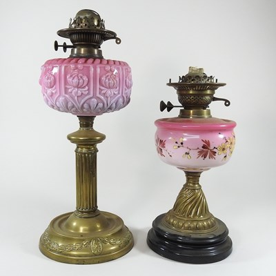 Lot 207 - Two brass and pink glass oil lamp bases