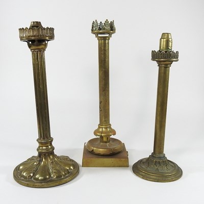 Lot 79 - Three brass candle lamps