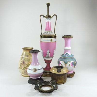 Lot 132 - Four oil lamp bases