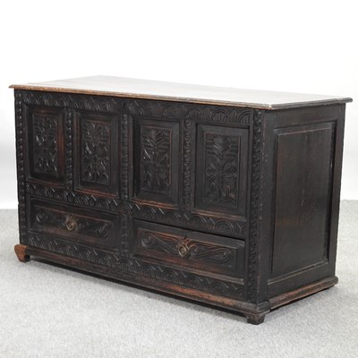 Lot 486 - A 19th century carved oak mule chest