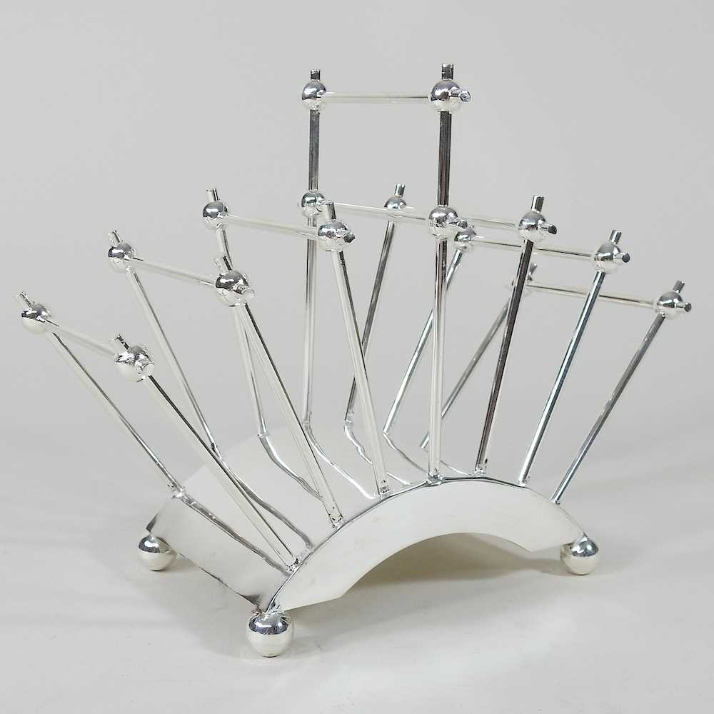 Lot 536 - A Christopher Dresser style toast rack