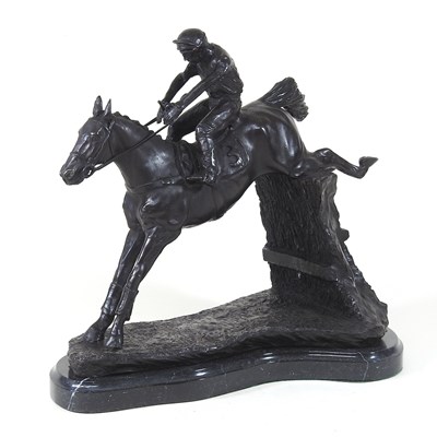 Lot 677 - A bronze horse and jockey