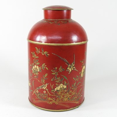 Lot 438 - A red tole style tea canister