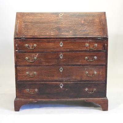 Lot 635 - A George III oak bureau