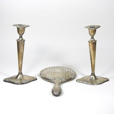 Lot 161 - A pair of Edwardian silver candlesticks