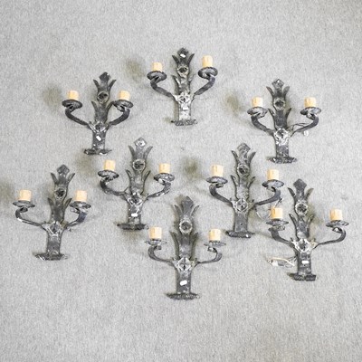 Lot 344 - A set of eight iron wall lights