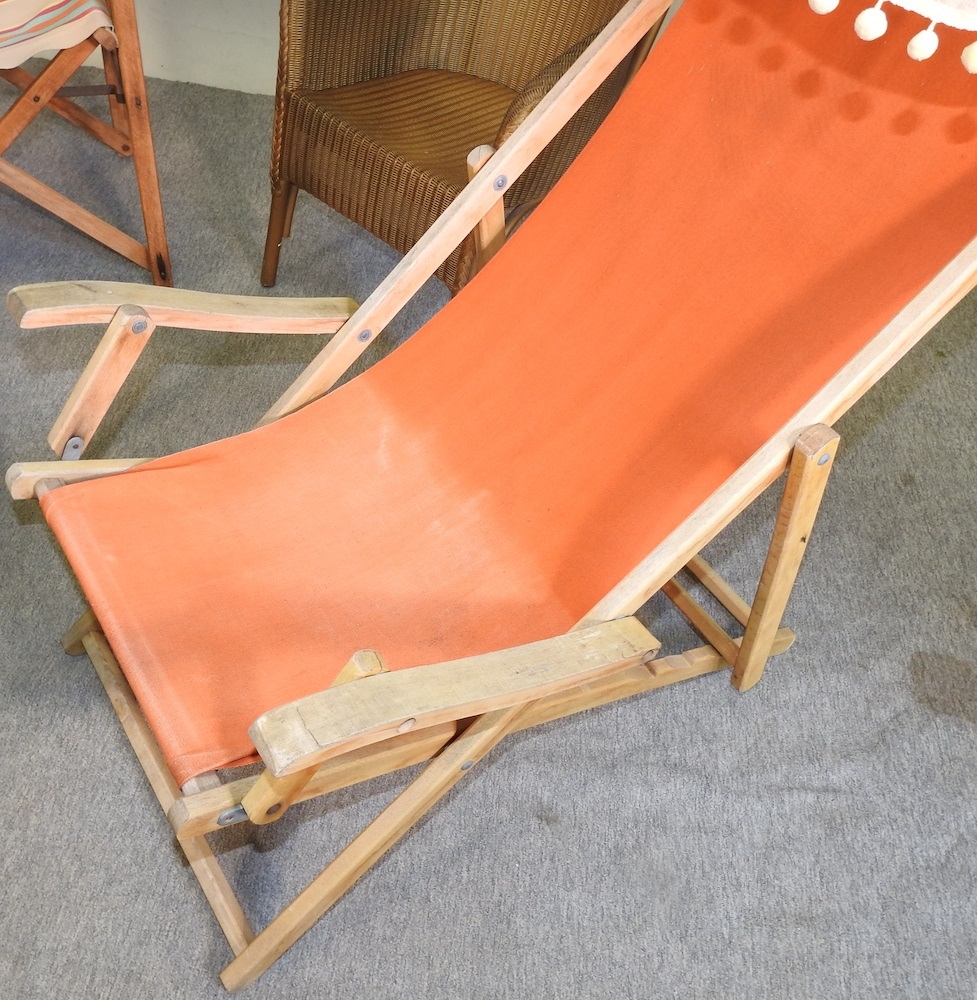 Lot 359 A folding deck chair with a canopy