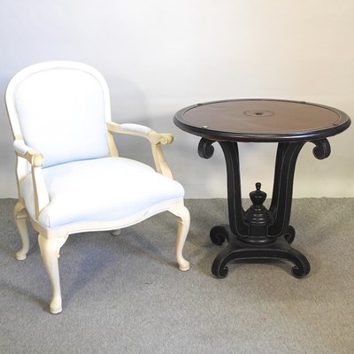 Lot 438 - An armchair and a table