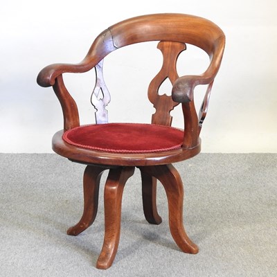 Lot 534 - A revolving desk chair