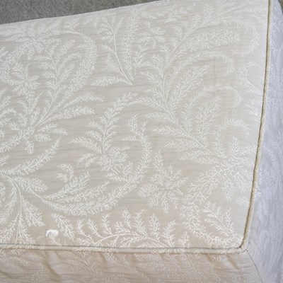 Lot 503 - A cream upholstered ottoman