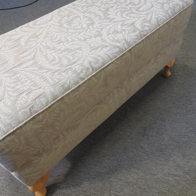 Lot 503 - A cream upholstered ottoman