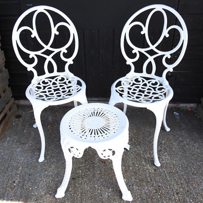 Lot 528 - A pair of white painted metal chairs