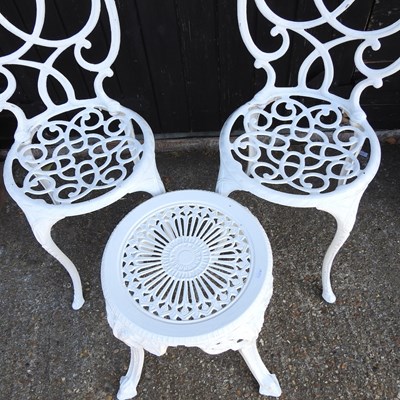 Lot 528 - A pair of white painted metal chairs